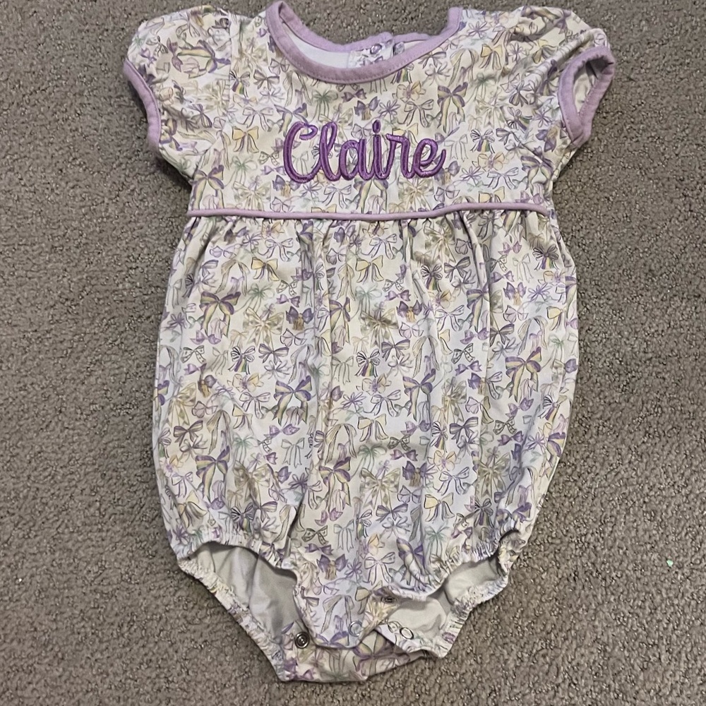 Monogrammed “Claire” bubble, 12 months, purple bows. Jellybean brand.